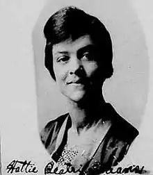 Black and white portrait of a black woman dressed in the attire of the 1920s