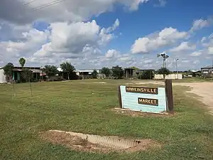 Hawkinsville Market sign is at the intersection of FM 457 and FM 2611 farther south.