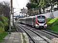 A westbound train consisting of E32000 EMUs used for Marmaray service.