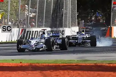 Image 112008 Australian Grand PrixPhoto credit: Fir0002Nick Heidfeld and Nico Rosberg at corner 6 of the 2008 Australian Grand Prix, during one of the race's safety car periods. This first race of the 2008 Formula One season was won by McLaren-Mercedes driver Lewis Hamilton. Heidfeld and Rosberg finished second and third, respectively.More selected pictures