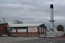 Image 16Heinz, although based in Hayes in Middlesex, has the largest food processing complex in Europe at a 55-acre (22 ha) site at Kitt Green in Wigan, which produces 1.4 billion cans of food each year; it is accessed to the east of the Orrell Interchange of the M6 (A577); the 38-acre Heinz NDC is next door (from North West England)