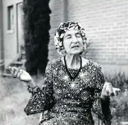 Black and white photograph of Helen Adam, seated