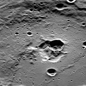 Oblique view facing west with the dark interior crater near center