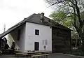 Hencz mill, the wall of the mill with a plaque dedicated to György Hencz, a former owner, taken from the east, Zalaegerszeg, 2005