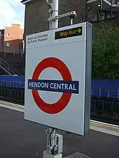 Roundel on southbound platform face, advising passengers for the R.A.F. Museum to alight at Colindale, one stop to the north