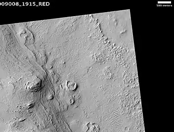 Henry Crater mound, as seen by HiRISE.  The scale bar is 500 m (1,600 ft) long