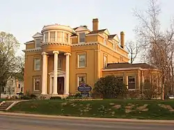 Old three-story mansion with columns and round observatory