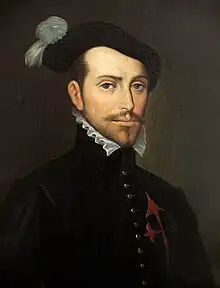 Old painting of a bearded young man facing slightly to the right. He is wearing a dark jacket with a high collar topped by a white ruff, with ornate buttons down the front. The painting is dark and set in an oval with the letters "HERNAN CORTES" in a rectangle underneath.