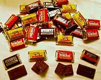 A packaged candy bar assortment of miniature versions of the Hershey’s Chocolate Bar, Hershey’s Special Dark Chocolate Bar, Krackel Chocolate Bar, and Mr. Goodbar