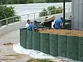 A crew installing barriers.