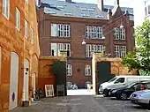 The gate towards Vester Voldgade and to the left the gable of the Hay Storage Building