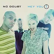 The artwork portrays the four main band members of No Doubt standing in a brightly-lit room.