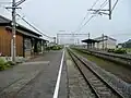 A view of the platforms and tracks. Note what appears to be the trackbed of a former track next to the platform to the left.