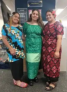 Photo of girls wearing traditional dress.