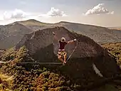 Alex Schulz on a stormy highline in France