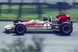 Lotus pioneered sponsorship in F1 through its deal with Imperial Tobacco, which resulted in the cars racing with a "Gold Leaf" livery. This is Graham Hill driving a Lotus 49B at the 1969 German Grand Prix.