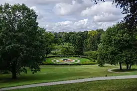 grassy hillside with garden planted in shape of maple leaf