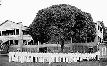 students in front of building