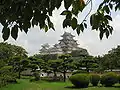 A view of keeps and the lush castle grounds below