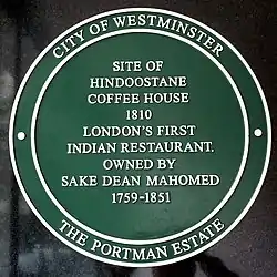 Plaque reads: Site of Hindoostane Coffee House – 1810 – London's first Indian restaurant – Owned by Sake Dean Mahomed 1759–1851