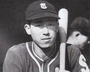 Ohshita in uniform with bat, age 24