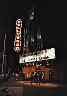 Exterior at night with neon sign illuminated (2011)