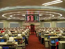 Large, empty room, with many desks and computer terminals