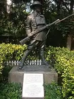 Statue of an anonymous World War I soldier from statuary collection of Eu Tong Sen. Also visible is the Battle of Hong Kong memorial plaque dedicated to all the defenders of Hong Kong in December 1941 through John Robert Osborn.