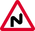 Double bend ahead first to right (symbol may be reversed)