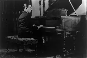 Vladimir Horowitz seated at the piano.