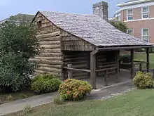 Log cabin in downtown Monticello, Kentucky, built in the early 19th century by "Raccoon" John Smith (1784–1868). The cabin was originally located in Horse Hollow on the Little South Fork River.