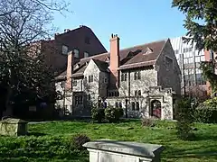 The Hospitium seen from the churchyard, with Town Hall to left and office development behind