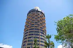 A cylindrical building against a night sky