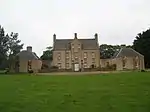 Front elevation showing the two pavilions in the forecourt. The one on the left (west) was for laundry; the one on the right (east) was a stable and coach house block