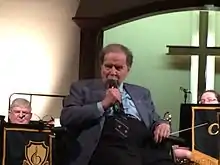 Howard Reid Cable introduces the story behind McIntyre Ranch Country, before conducting it with the Clarington Concert Band at a concert in Oshawa, Ontario.