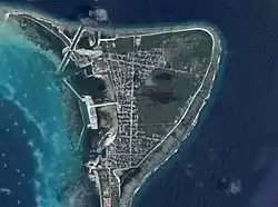 Satellite view of the island with Meedhoo being the top (north) half and Hulhudhoo being the bottom (south) half.