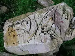 Hydrodemolition damage to a sandstone block from the bridge