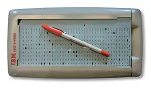 Image 12An IBM Port-A-Punch punched card