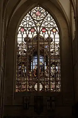 Southern transept: stained glass window by Jan Haeck after Bernard van Orley depicting Louis II of Hungary (1538)