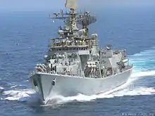 Grey ship moving towards the camera