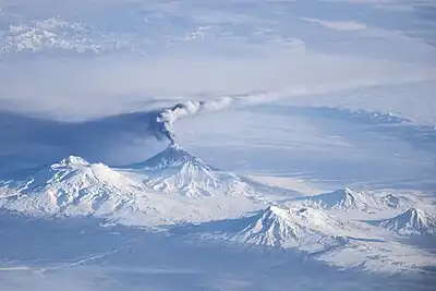 Annotated view includes Ushkovsky, Tolbachik, Bezymianny, Zimina, and Udina. Oblique view taken on November 16, 2013 from ISS. Bezymianny can be seen 2nd from the right. A small plume of "smoke" can be seen.