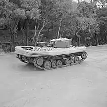 Valentine DD tank with screen lowered and gun pointing towards the rear of the vehicle.