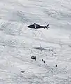 Transport of the equipment to the Morteratsch Glacier by a helicopter