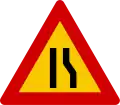 Road narrows on right hand side