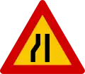 Road narrows on left hand side