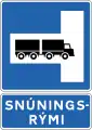 Place for turning on left - Signs indicating large vehicles may be turned around, e.g. in tunnel. Further information is provided on an additional sign below.