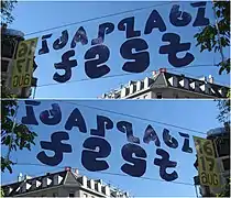 A practical application of mirror ambigrams in a banner reading "Idaplatz fest" front and back (Zurich, 2008).