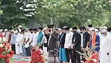 Muslims, wearing face masks gather for the Eid al Adha prayer in Indonesia.