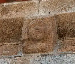 Church of Mouçós with human faces on its modillions.