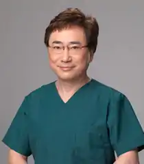 Katsuya Takasu in his scrubs